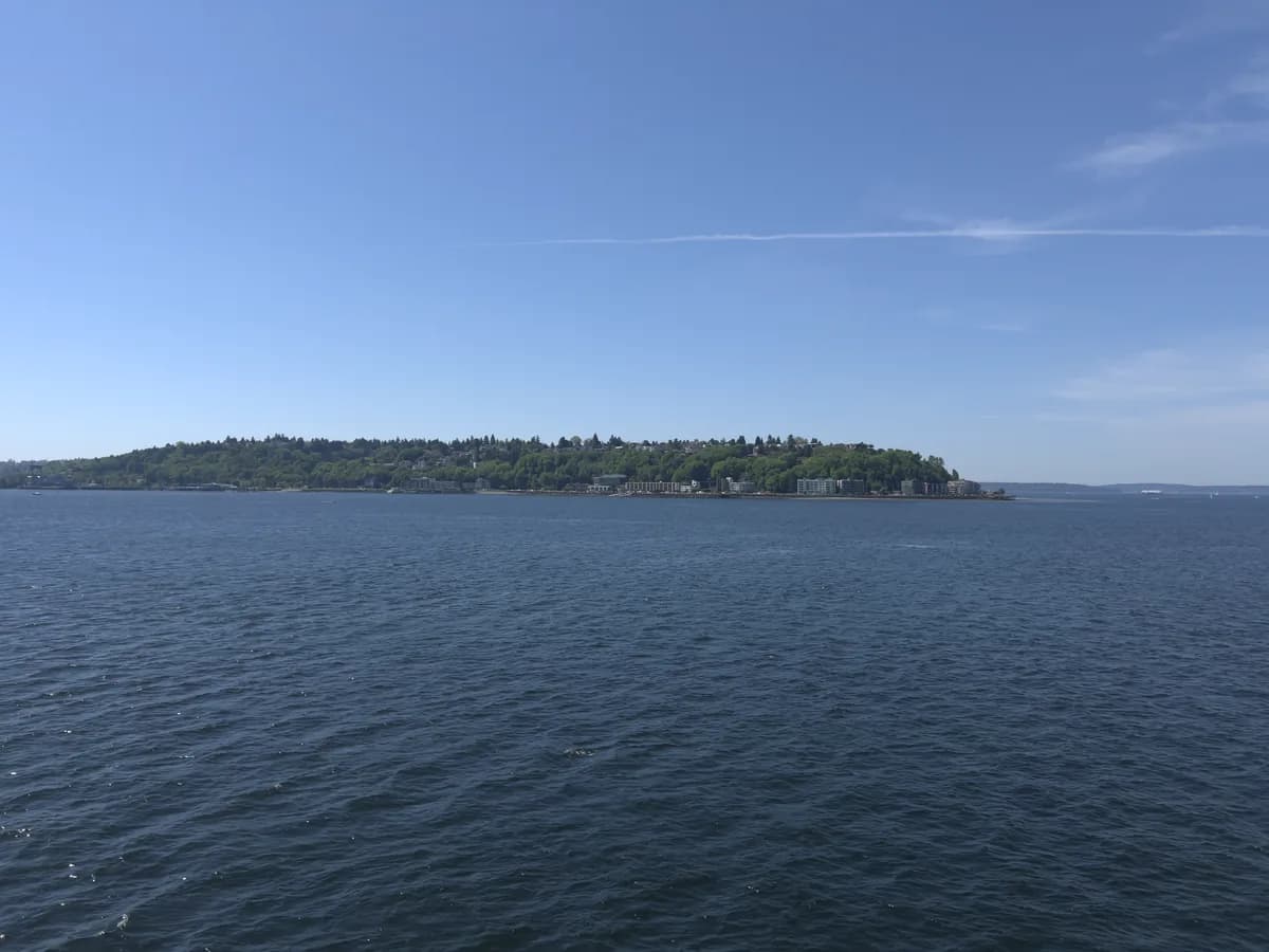 View across Puget Sound from West Seattle, looking out at a wooded island