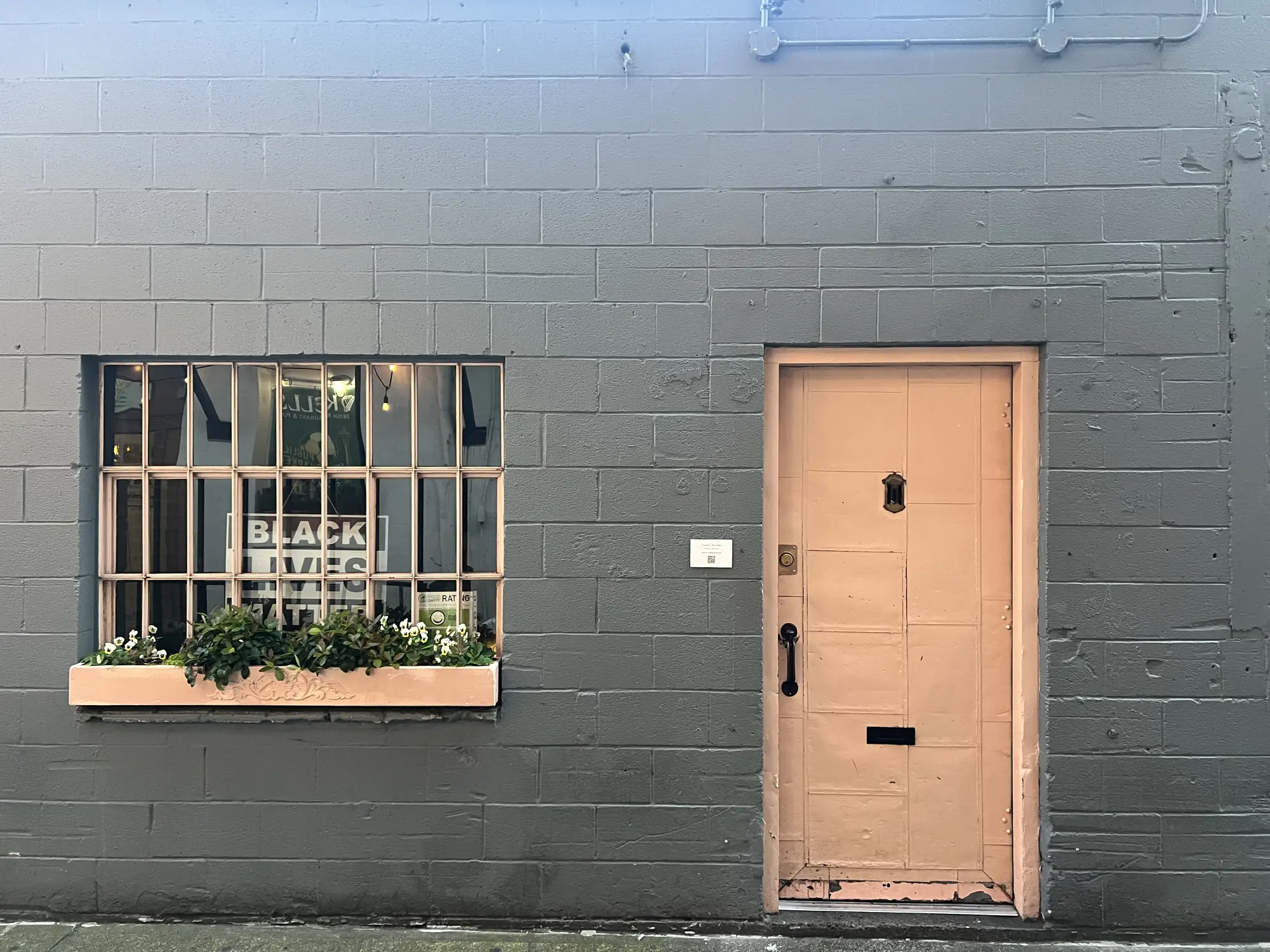 The Pink Door — the unmarked pink door in Post Alley, the entrance most visitors walk past without noticing